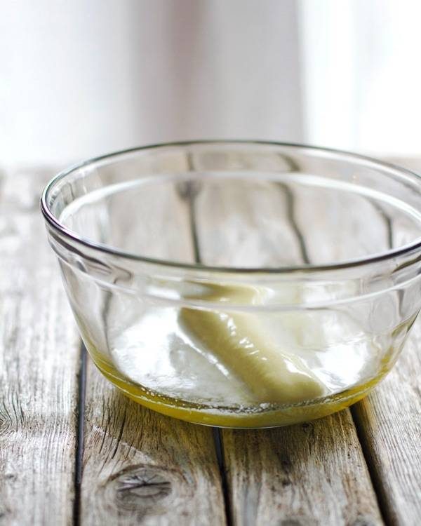 Melted butter in a clear mixing bowl.