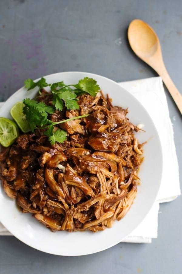 Honey Glazed Crockpot Chicken Adobo on a white plate.
