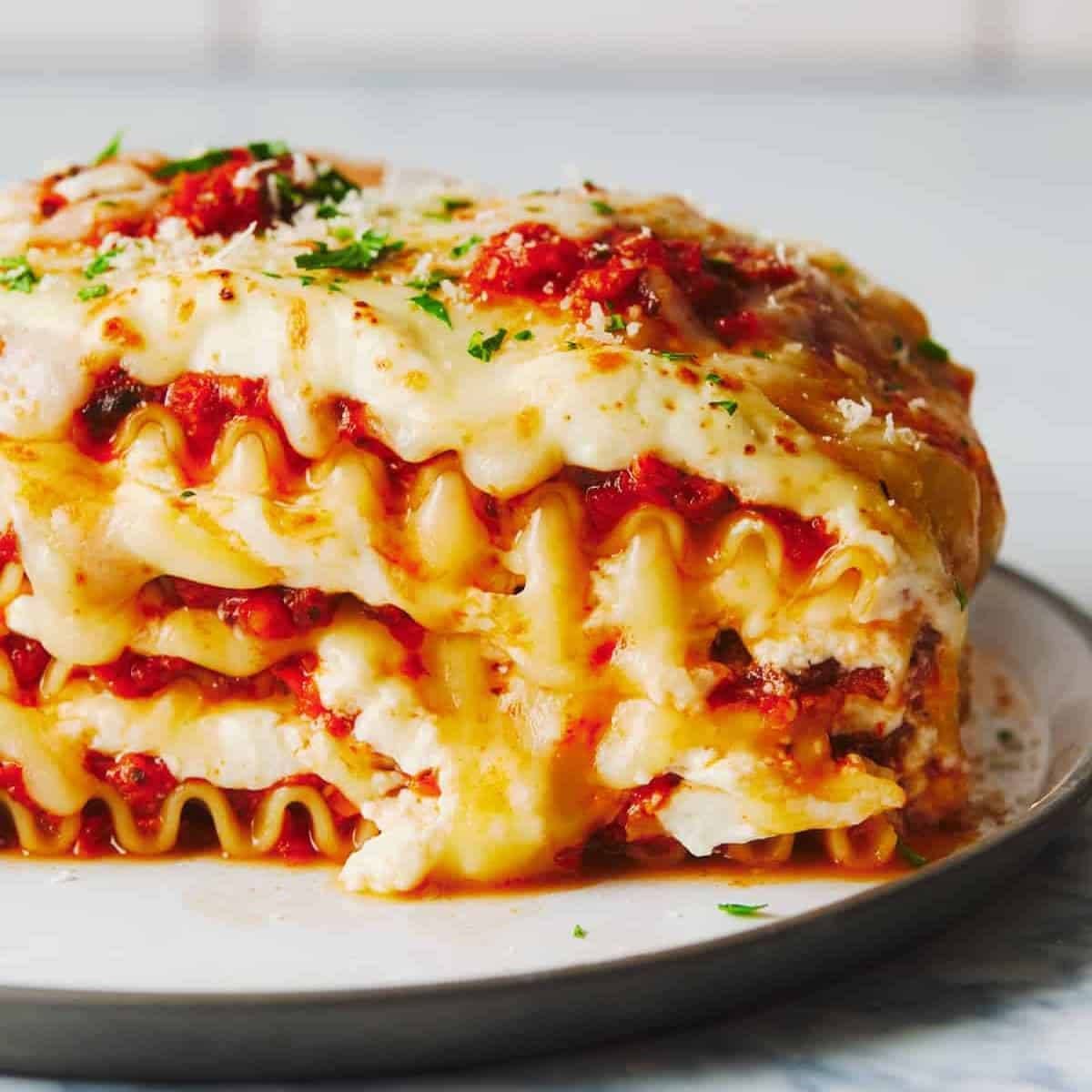 Layers of lasagna set on a plate.