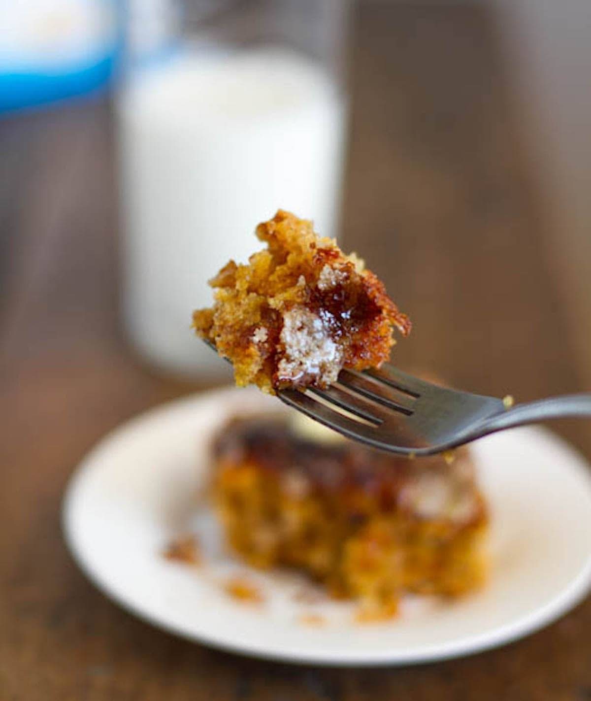 Mango snack cake with a crunchy sugar topping on a fork.