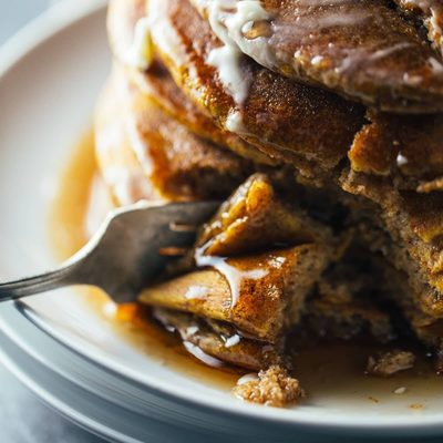 Cinnamon Pumpkin Pancakes cut with bite taken out.